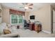 Functional home office space with a comfortable seating area and a desk at 7052 Camp Falls Ct, Winston, GA 30187