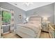 Cozy bedroom featuring natural light, comfortable bedding, and modern decor at 1039 Avery Creek Dr, Woodstock, GA 30188