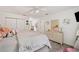 Comfortable bedroom featuring a large bed, a dresser with a mirror, and plenty of natural light from the windows at 1039 Avery Creek Dr, Woodstock, GA 30188