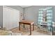 This light filled bedroom features a spacious closet, wood floors, and a desk with a window view at 1039 Avery Creek Dr, Woodstock, GA 30188