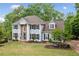 Gorgeous two-story home with well-manicured lawn and landscaping, offers great curb appeal at 1039 Avery Creek Dr, Woodstock, GA 30188