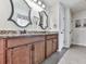 Bathroom vanity featuring dual sinks, granite counters, and storage at 423 Livingston Pt, Acworth, GA 30102