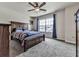 Bedroom with large window, ceiling fan, and plush carpet at 423 Livingston Pt, Acworth, GA 30102