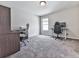 Versatile bedroom space with two desks, chairs, and neutral carpet at 423 Livingston Pt, Acworth, GA 30102