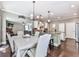 Bright dining area with an open layout, hardwood floors, and a view to the living area at 423 Livingston Pt, Acworth, GA 30102