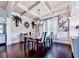 Formal dining room with coffered ceilings, elegant decor, and a stylish table set at 423 Livingston Pt, Acworth, GA 30102