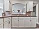 Bright kitchen featuring white cabinets, granite countertops, and stainless steel appliances at 423 Livingston Pt, Acworth, GA 30102