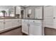 Charming kitchen with white cabinets, granite countertops, a center island, and wood flooring at 423 Livingston Pt, Acworth, GA 30102
