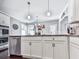Modern kitchen featuring white cabinets, stainless steel appliances, and granite countertops at 423 Livingston Pt, Acworth, GA 30102