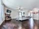 Bright living room with a cozy fireplace, hardwood floors, and comfortable seating at 423 Livingston Pt, Acworth, GA 30102