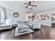 Spacious living room with hardwood floors, a modern sectional, and an open layout at 423 Livingston Pt, Acworth, GA 30102