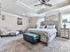 Serene main bedroom featuring a tray ceiling, plush carpet, and stylish furniture at 423 Livingston Pt, Acworth, GA 30102