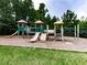 Community playground featuring slides, climbing structures, and a wood chip base at 423 Livingston Pt, Acworth, GA 30102