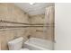 Cozy bathroom featuring a tiled shower, grab bar, and glass shelf at 57 Cantey Nw Pl, Atlanta, GA 30327