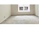 Bedroom featuring a large window, neutral-toned walls, and a closet at 57 Cantey Nw Pl, Atlanta, GA 30327
