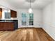 Open dining area with hardwood floors and access to backyard at 57 Cantey Nw Pl, Atlanta, GA 30327