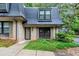 Charming townhouse with brick facade, mature landscaping, and a distinctive slate roof at 57 Cantey Nw Pl, Atlanta, GA 30327