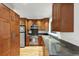 Modern kitchen with stainless steel appliances, sleek countertops, and custom wood cabinets at 57 Cantey Nw Pl, Atlanta, GA 30327