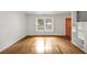 Inviting living space with wood floors, bright white walls, and natural light from double windows at 57 Cantey Nw Pl, Atlanta, GA 30327