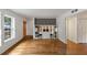 Bright living room featuring hardwood floors, a large window, and custom built-in shelving at 57 Cantey Nw Pl, Atlanta, GA 30327