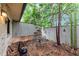 Relaxing brick patio with metal furniture and serene view with tall privacy fence at 57 Cantey Nw Pl, Atlanta, GA 30327