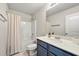 Bathroom with modern vanity and sink, shower-tub combo, and neutral color palette at 2680 Lower Village Dr, Ellenwood, GA 30294