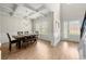 Well-lit dining room with coffered ceilings and views to the front yard and entryway at 2680 Lower Village Dr, Ellenwood, GA 30294