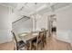 Dining room featuring wood floors, a chandelier, and views into the kitchen at 2680 Lower Village Dr, Ellenwood, GA 30294