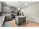 Updated kitchen featuring a center island, pendant lighting, and stainless steel appliances at 2680 Lower Village Dr, Ellenwood, GA 30294