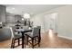 Kitchen with modern gray cabinetry, stainless steel appliances, and a four-chair dining set at 2680 Lower Village Dr, Ellenwood, GA 30294