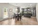Modern kitchen with stainless steel appliances, ample cabinets, and a four-chair dining set with view of the back yard at 2680 Lower Village Dr, Ellenwood, GA 30294