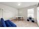 Bright office with a sofa, desk, and plenty of room for storage at 2680 Lower Village Dr, Ellenwood, GA 30294