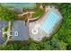 Aerial shot of the swimming pool and clubhouse featuring lounge chairs and dining tables at 2688 Hidden Falls Ne Dr, Buford, GA 30519