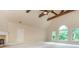 Spacious bonus room with high ceilings, exposed wood beams, a fireplace, and large windows for plenty of natural light at 2688 Hidden Falls Ne Dr, Buford, GA 30519