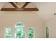 Bonus room with high ceilings, exposed wood beams, and large windows allowing lots of natural light at 2688 Hidden Falls Ne Dr, Buford, GA 30519