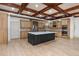 Modern kitchen featuring a dark island, stainless steel appliances, and custom cabinets at 2688 Hidden Falls Ne Dr, Buford, GA 30519