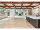 Open-concept home with kitchen island overlooking living room and access to the back porch at 2688 Hidden Falls Ne Dr, Buford, GA 30519