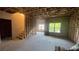 Unfinished basement space with exposed framing, a staircase, and a window for natural light at 3208 Sonnet Se Walk, Atlanta, GA 30339
