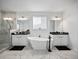 Spacious bathroom features a free-standing tub, separate vanities, and a glass enclosed shower at 3208 Sonnet Se Walk, Atlanta, GA 30339