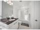 Bathroom featuring a sleek vanity, marble floors, and a shower-tub combo at 3208 Sonnet Se Walk, Atlanta, GA 30339