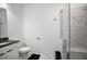 Bathroom featuring a toilet, vanity, and glass shower with marble tile at 3208 Sonnet Se Walk, Atlanta, GA 30339