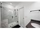 Stylish bathroom featuring a marble tiled shower, sleek black fixtures, and a modern vanity at 3208 Sonnet Se Walk, Atlanta, GA 30339
