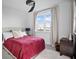 Bright bedroom with a modern ceiling fan and a comfortable-looking bed with red bedspread at 3208 Sonnet Se Walk, Atlanta, GA 30339
