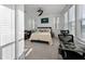 Well-lit bedroom features a comfortable bed, desk, and chair, perfect for relaxation and productivity at 3208 Sonnet Se Walk, Atlanta, GA 30339