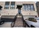 Inviting townhome entry with brick staircase leading to a covered doorway and private garage at 3208 Sonnet Se Walk, Atlanta, GA 30339