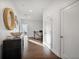 Upstairs hallway boasts hardwood floors, fresh paint, and white doors leading to other rooms at 3208 Sonnet Se Walk, Atlanta, GA 30339