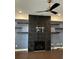 Living room features include fireplace, TV mount, floating shelves, and modern ceiling fan at 3208 Sonnet Se Walk, Atlanta, GA 30339