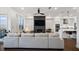 Open-concept living space connecting living and kitchen areas, with a modern fireplace feature at 3208 Sonnet Se Walk, Atlanta, GA 30339