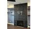 Living room features include fireplace, TV mount, floating shelves, and modern ceiling fan at 3208 Sonnet Se Walk, Atlanta, GA 30339