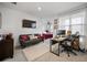 Open floor plan living room with tv over a sofa and desk area at 3208 Sonnet Se Walk, Atlanta, GA 30339